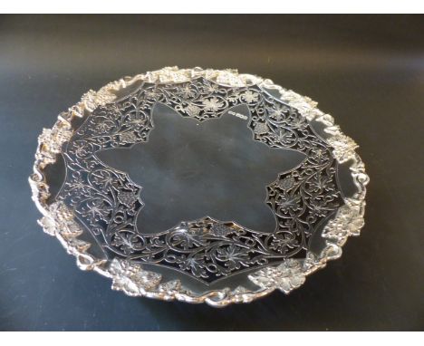 A silver tazza with cut carved vine border embossed rim on pedestal foot. Sheffield 1945. 27cm diameter. 20ozs