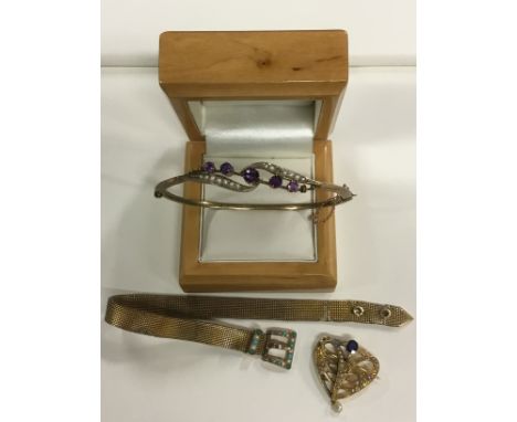 A gold coloured stiff bracelet set with amethyst and seed pearls, a 9ct bracelet with turquoise and seed pearl buckle clasp, 
