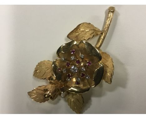 An 18ct diamond and ruby set rose flower brooch. 7cm