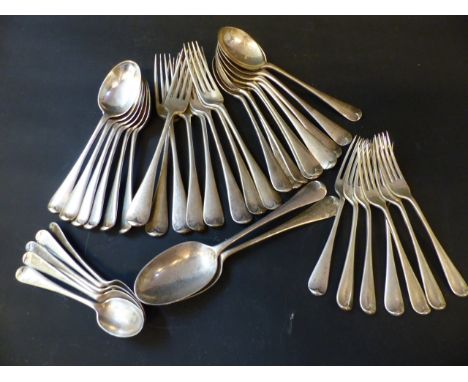 A silver Old English pattern part flatware service comprising eight table forks, seven dessert forks, nine soup spoons, six d