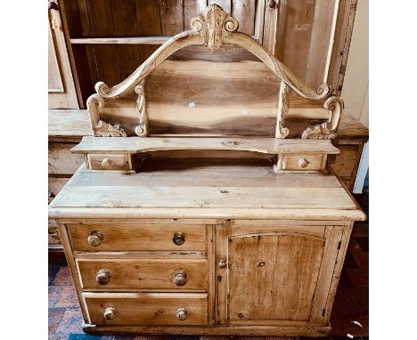 A 20th century pine dressing chest, carved serpentine quarter gallery, above a shelf supported by twin interior drawers, slig