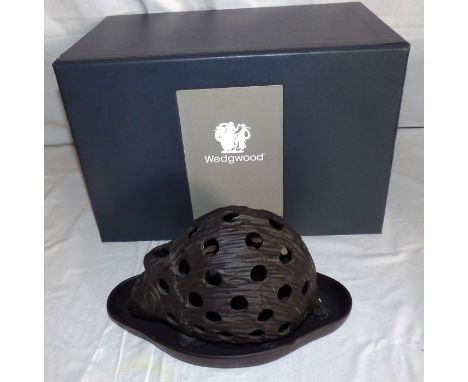 A boxed Wedgwood black basalt hedgehog crocus planter and stand impressed marks