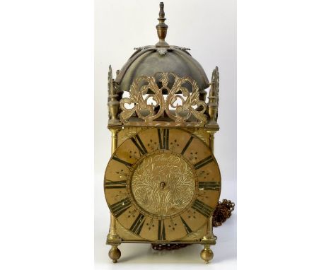 A 17th Century brass lantern clock by Deodatus Threlkeld (1658-1723), Newcastle, circa 1680, strapped bell over urn finials, 