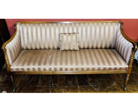 A Regency revival mahogany square three seater sofa, in a Gillows influence, scrolling arms on turned pillows supports, damas