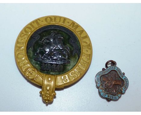 A badge for the Royal costume costume ball of 1840 , showing St George and the dragon and the Royal motto honi soit qui m pen