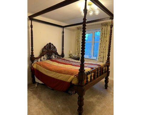 A Victorian mahogany colonial four poster bed, circa 1860 and later, moulded&nbsp;cornice supported by four barley twist colu