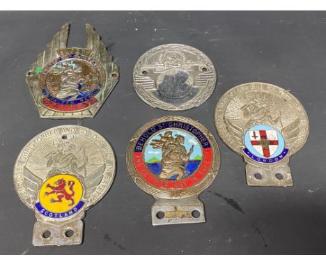 Five St. Christopher car badges, two with enamel location plaques for London and Scotland. 
