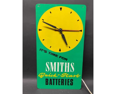 A Smiths Quick-Start Batteries wall clock, 9 x 16 1/2".