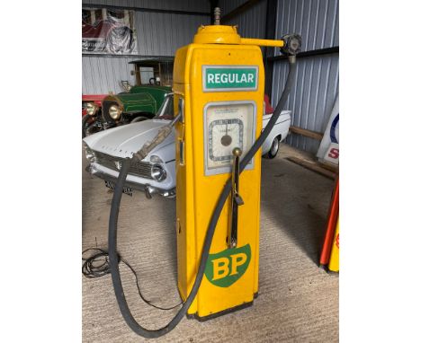 An Avery Hardoll clockface petrol pump with handle to the front, appears to have had mechanism removed, in BP Regular livery.