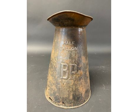 A BP half gallon measure with wide neck and embossed lettering.