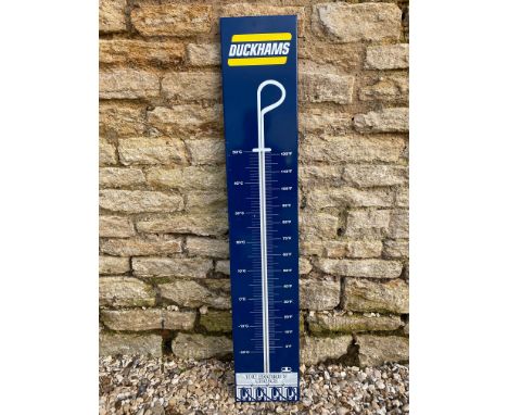 A Duckhams enamel thermometer, 8 x 43 3/4". 