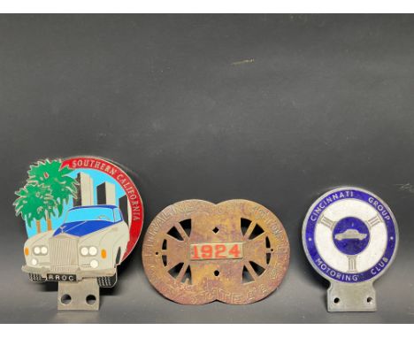 A Rolls-Royce Owners Club (RROC) Southern California enamel car badge, a Cincinnati Group Motoring Club car badge and a Centr