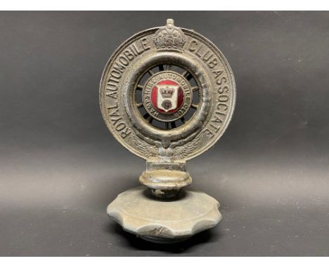 An RAC Associate car badge with a Hampshire Automobile Club enamel centre, mounted on a radiator cap. 