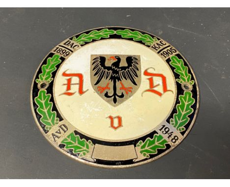 A German circular enamel car badge bearing three dates between 1899-1948, stamped to verso, 4" diameter. 
