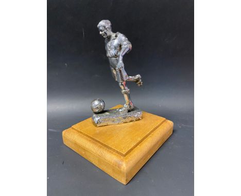 A Desmo accessory mascot in the form of a footballer, display base mounted. 