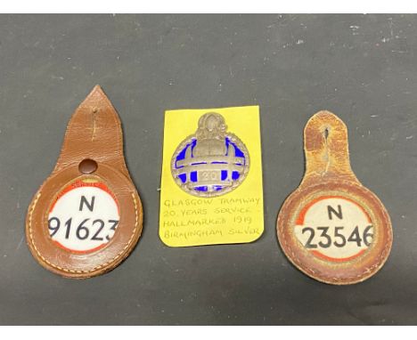 A Glasgow Tramway 20 Years Service silver and blue enamel badge plus two bus identity tags. 
