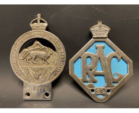 A Royal East African Automobile Association badge no. L8111 plus a second RAC South African badge.