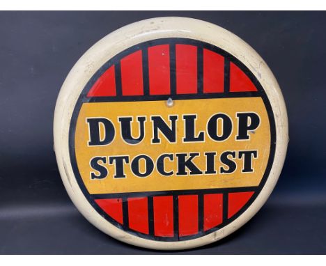 A Dunlop Stockist circular tin advertising sign, dated 1956, 24" diameter.