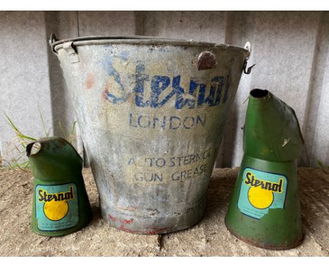 A Sternol quart oil measure, a matching pint example plus a galvanised lidded bucket bearing Sternol decal.