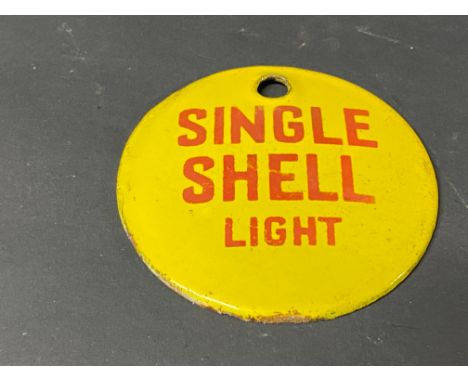 A small circular enamel brand tag for Single Shell Light, 2 3/4" diameter.