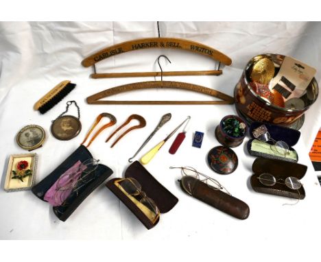 Assorted vintage items from a ladies dressing table drawer, spectacles, hair combs, badges, silver topped button hook, Carlis