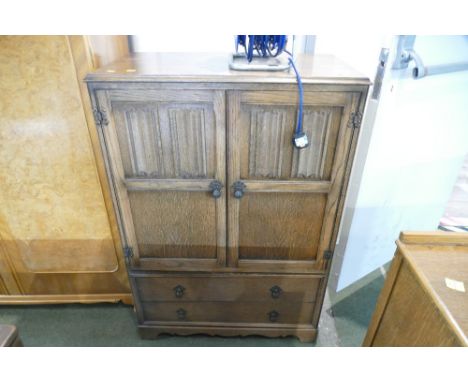 Linen fold fronted oak press cupboard or tallboy