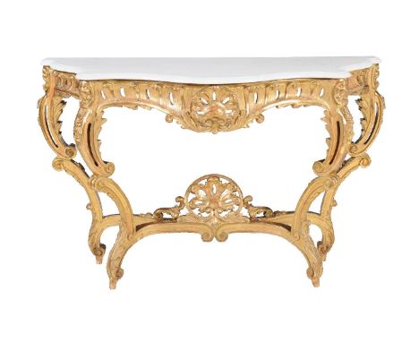 A giltwood and marble topped console table, in the Rococo style, mid-19th century, the shaped white marble top above scroll f