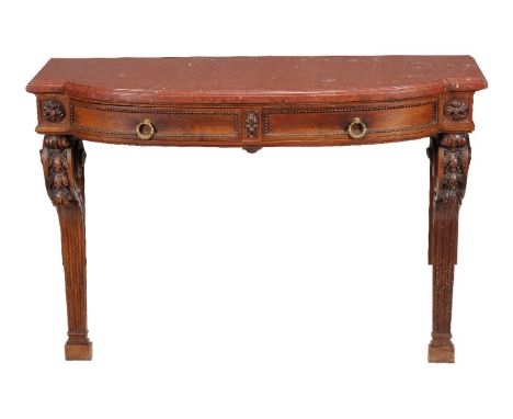 An oak console table, late 19th century, of break bowfront outline, with a red  marble top above two frieze drawers with cent