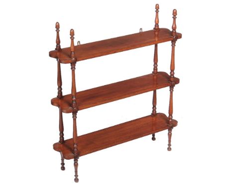 A flight of Victorian mahogany hanging wall shelves, mid 19th century, each shelf divided by turned pillars and surmounted by