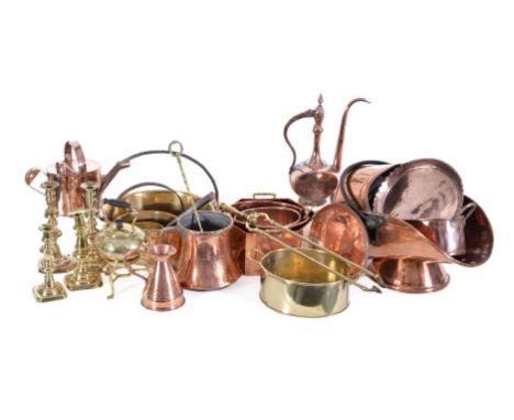 A collection of domestic brass and copperware, 19th and 20th century, comprising a coal scuttle, various trays, five twin han