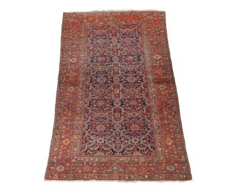 A Fereghan kelleh or gallery carpet,  the polychrome decorated navy field within a madder border, approximately 298 x 161cm P