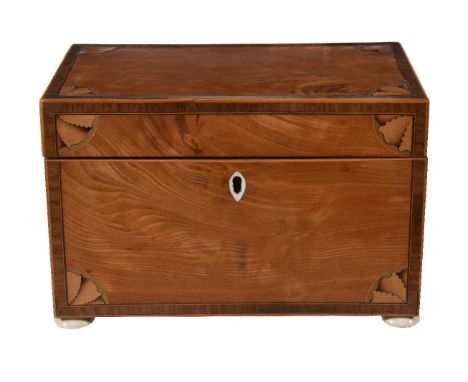Y A George III satinwood and marquetry tea caddy in Sheraton style, late 18th century, of rectangular form, the hinged cover 