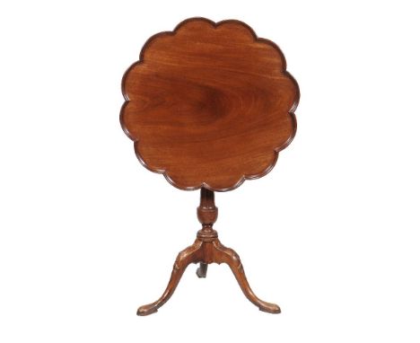 A mahogany tripod table in George III style, 19th century, with birdcage action above a fluted stem and carved outswept legs,