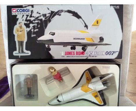 Corgi James Bond Space Shuttle and Hugo Drax figure scale model die cast cars in original display box and packaging . Good co