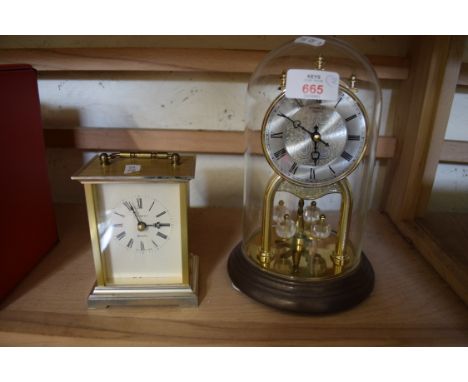 DOME TOP ANNIVERSARY CLOCK AND A QUARTZ OPERATED CARRIAGE CLOCK