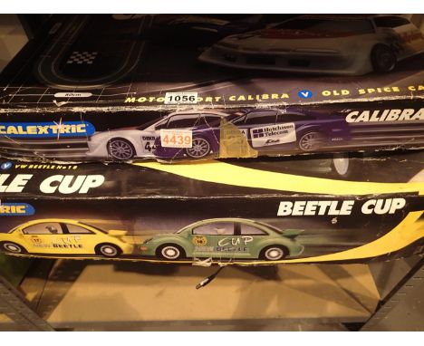Two Scalextric boxed sets to include Calibre Cup and Beetle Cup. Not available for in-house P&amp;P, contact Paul O'Hea at Ma