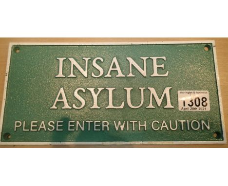 Cast iron Insane Asylum sign, L: 27 cm. P&amp;P Group 1 (£14+VAT for the first lot and £1+VAT for subsequent lots) 