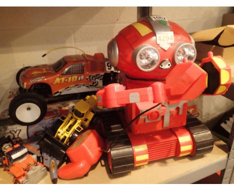 Shelf of mixed toys including Toy Story 3 train set and a remote control robot. Not available for in-house P&amp;P, contact P