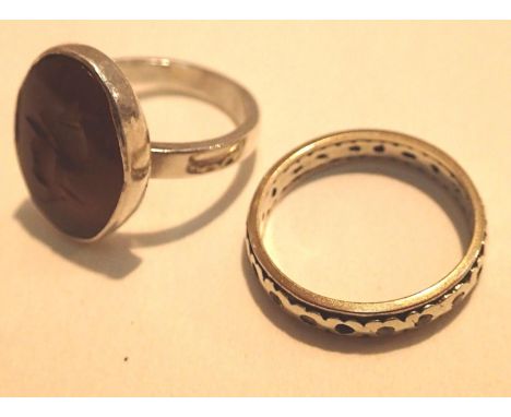 Two rings gold and silver eternity ring with wear and an orange stone intaglio ring. P&amp;P Group 1 (£14+VAT for the first l