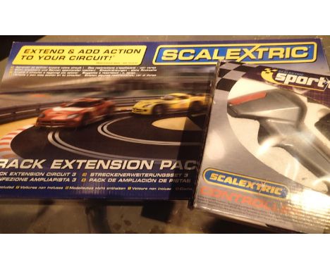 Five Scalextric sport digital controller and a track extension pack unchecked and a large childs teddy. Not available for in-