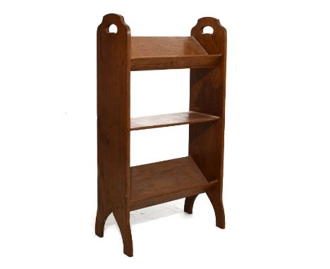Early 20th Century oak book trough with two sloping tiers flanking flat central shelf between ends with pierced carry handles