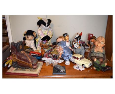 Large selection of assorted toys to include; two small bisque headed dolls, teddy bear, badger, Laurel & Hardy figures, playi