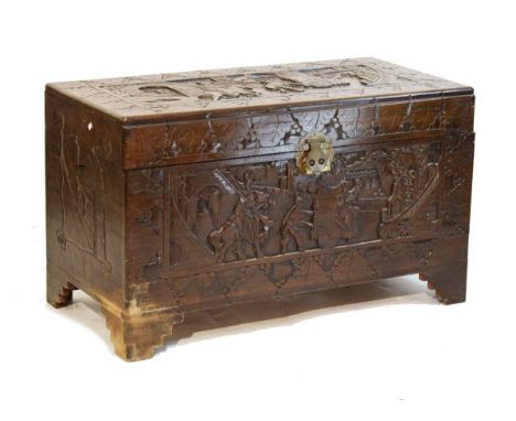 Early 20th Century Chinese camphor wood trunk or bedding chest with carved hinged lid and front   Condition: 