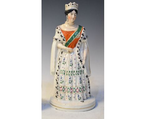 19th Century Staffordshire pottery figure depicting the young Queen Victoria wearing an ermine cloak and a floral sprigged dr
