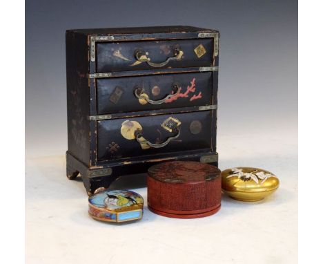 Small Japanese lacquered table chest of three drawers, a red lacquered box and cover, a Japanese porcelain circular box and c