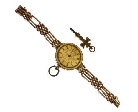 Early 20th Century lady's converted engraved yellow metal key wind fob watch, the case stamped 9k, now with an attached yello