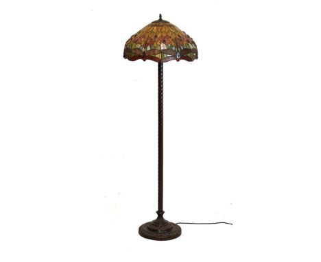 Tiffany style standard lamp with stained glass mushroom shaped shade, over bronzed spiral column on circular base   Condition