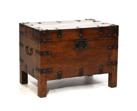 Late 18th/early 19th Century iron bound miniature trunk in the campaign style, the hinged cover and front with strap work dec