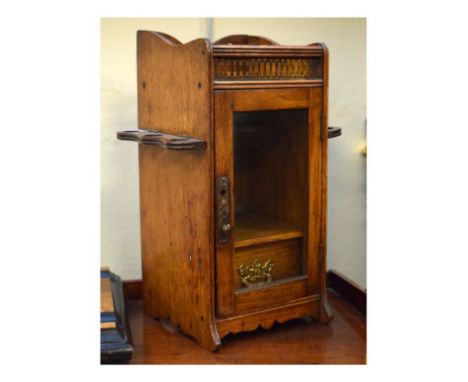 Edwardian oak smokers cabinet with glazed door and pipe racks   Condition: 