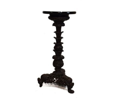 19th Century Burmese heavily carved hardwood pillar and tripod table base having a modern circular ebonised top   Condition: 